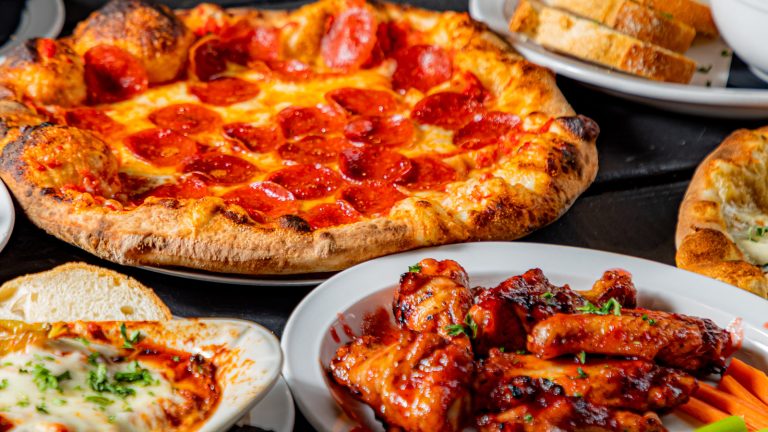 How Pizza and Chicken Wings Became a Timeless Pairing